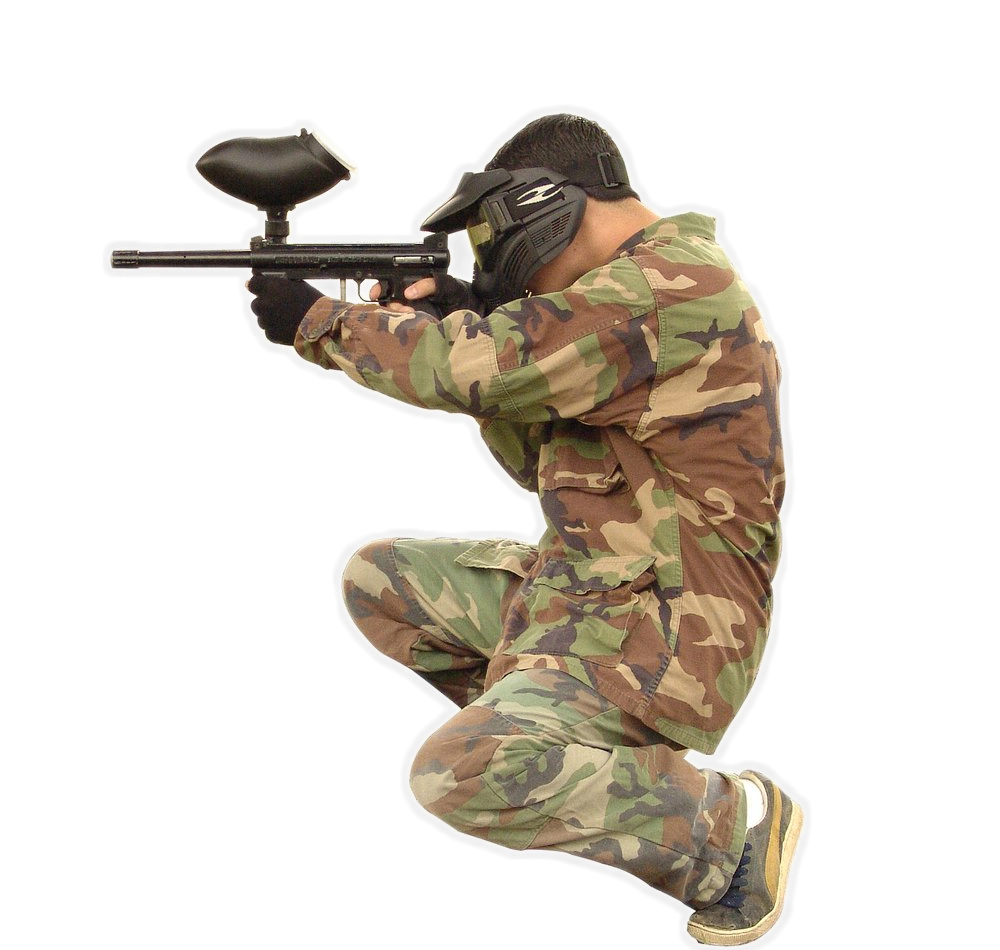 Man crouching holding a paintball gun